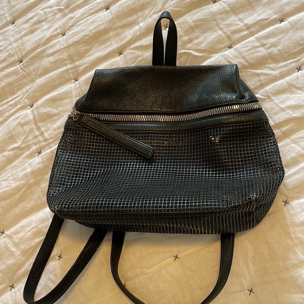 Kara large leather and mesh backpack with an inside pocket and outside pockets